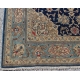 Tapis persan en laine fond bleu décor fleurs