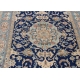 Tapis persan en laine fond bleu décor fleurs