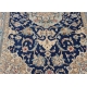 Tapis persan en laine fond bleu décor fleurs
