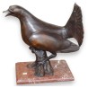 Bronze heather cockerel on a red marble plinth