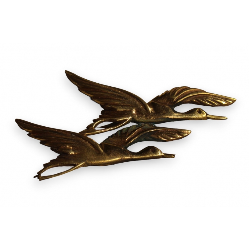 Broche "Cygnes en vol" en bronze doré