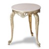 Small round table in polished brass, with a marble top