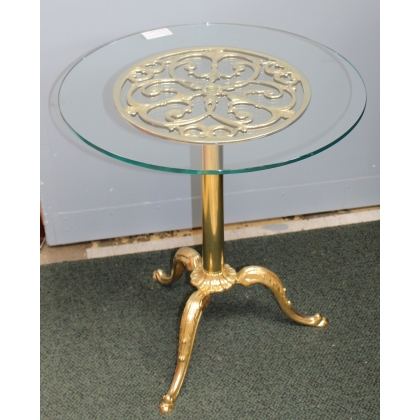 Small round table in polished brass, with a glass top