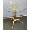Small round table in polished brass, with a glass top