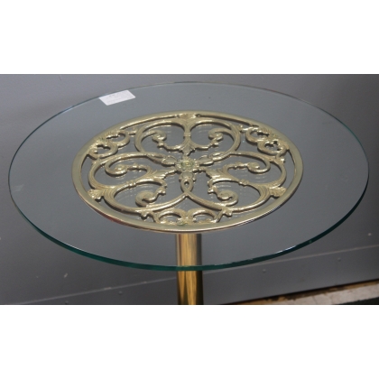 Small round table in polished brass, with a glass top