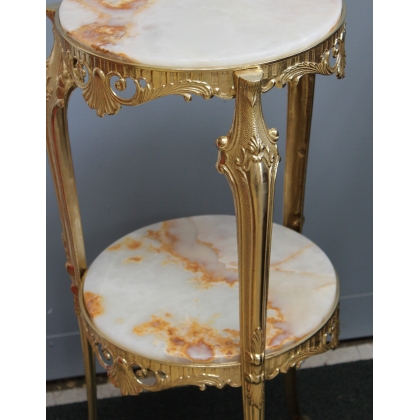 Small round table in polished brass with two tiers