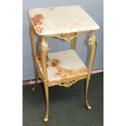 Small square table in polished brass with two tops