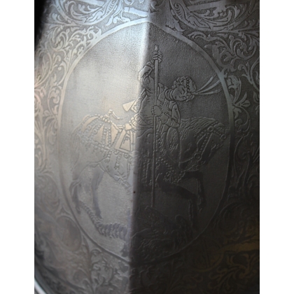 Engraved iron armour depicting St George slaying the dragon
