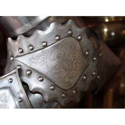 Engraved iron armour depicting St George slaying the dragon