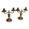 A pair of silver-plated bronze two-candle candlesticks