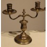 A pair of silver-plated bronze two-candle candlesticks