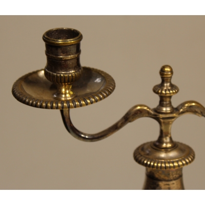 A pair of silver-plated bronze two-candle candlesticks