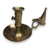 Brass bowl-shaped candle holder with a candle snuffer