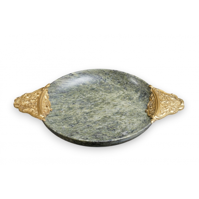 A cup carved from speckled green hardstone