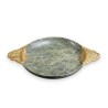 A cup carved from speckled green hardstone
