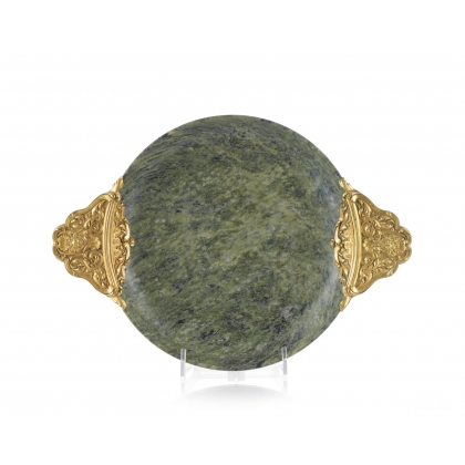 A cup carved from speckled green hardstone