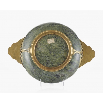 A cup carved from speckled green hardstone