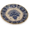 Plat rond décor au paon en faïence de Delft