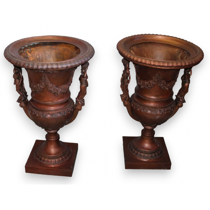 Pair of bronze vases with female handles