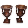 Pair of bronze vases with female handles