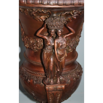 Pair of bronze vases with female handles