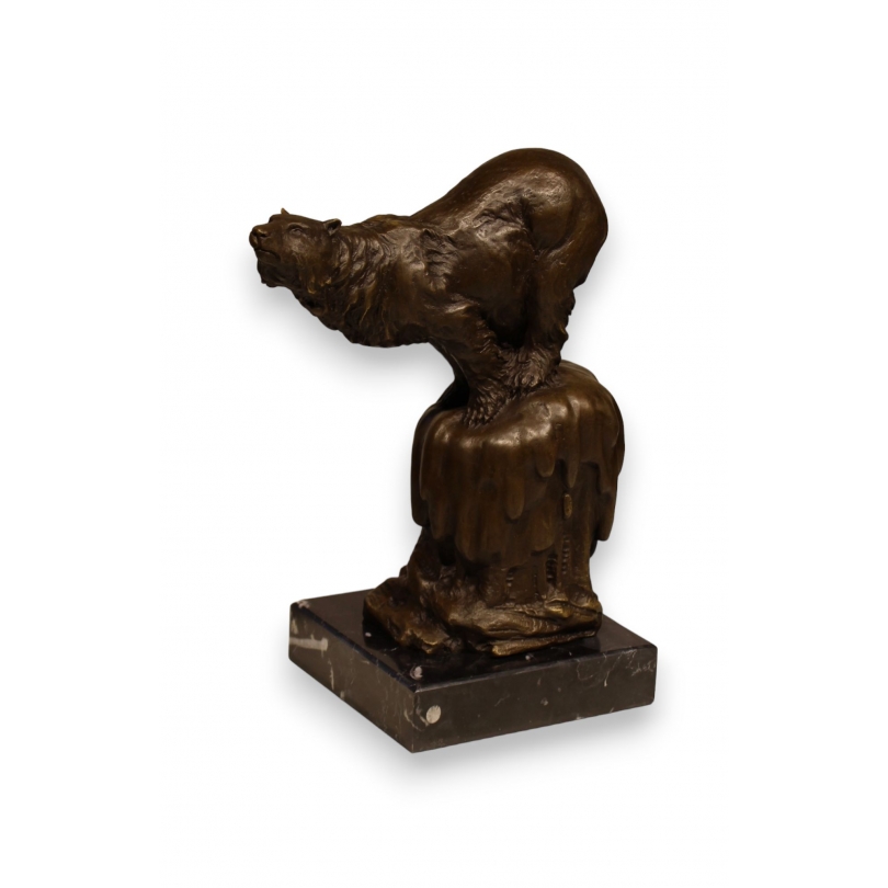 Bronze polar bear, on a black marble plinth