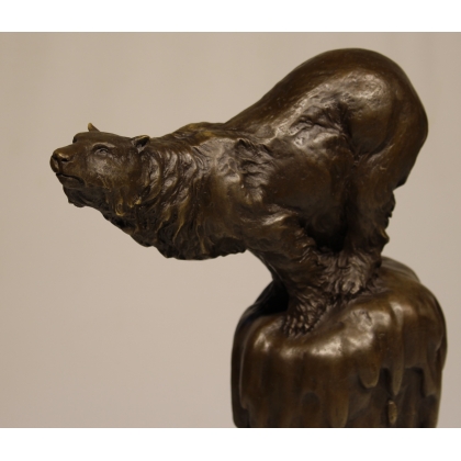 Bronze polar bear, on a black marble plinth