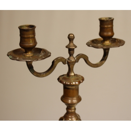A pair of Louis XV two-candle candlesticks