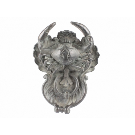 Crab-shaped door knocker in bronze with a green patina