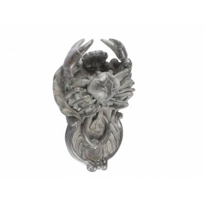Crab-shaped door knocker in bronze with a green patina