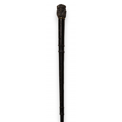 A rare flute cane with a pommel featuring six faces