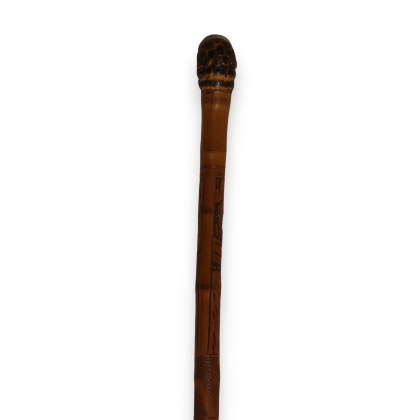 Single-piece bamboo walking stick with engraved decoration