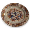 Assiette en porcelaine décor vase de fleurs