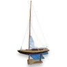 Model of a blue-hulled sailing boat