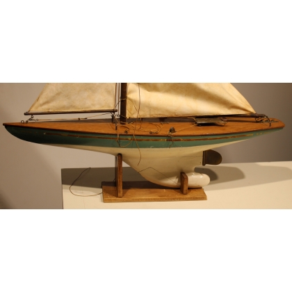Model of a sailing boat with a green hull