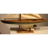 Model of a sailing boat with a green hull