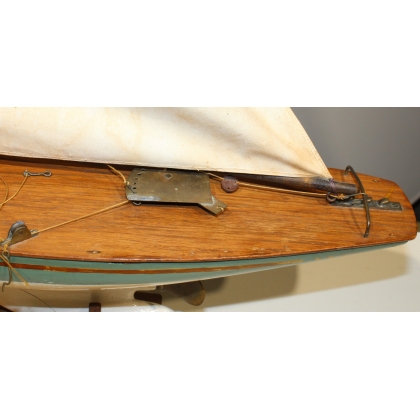 Model of a sailing boat with a green hull