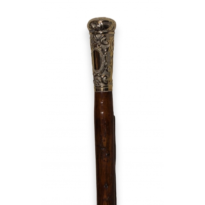 Walking stick with a silver-coloured metal knob featuring arabesque designs