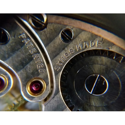 TAVANNES gold watch, black leather strap