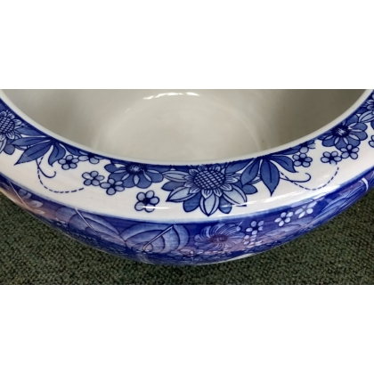 Blue and white plant pot with a butterfly design