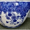 Blue and white plant pot with a butterfly design