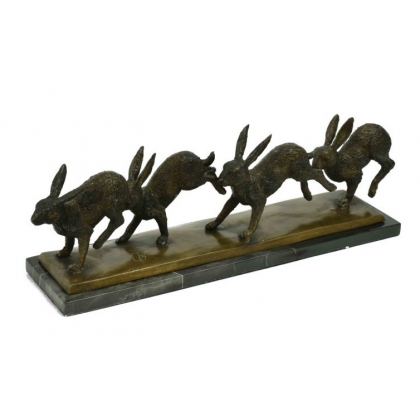 Suite de quatre lièvres en bronze, socle marbre