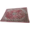 Sarouk carpet with a red background