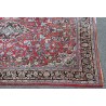 Sarouk carpet with a red background