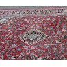 Sarouk carpet with a red background