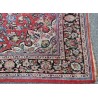 Sarouk carpet with a red background