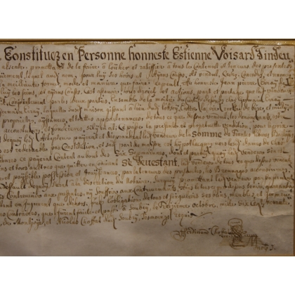 Document ancien encadré daté 1699
