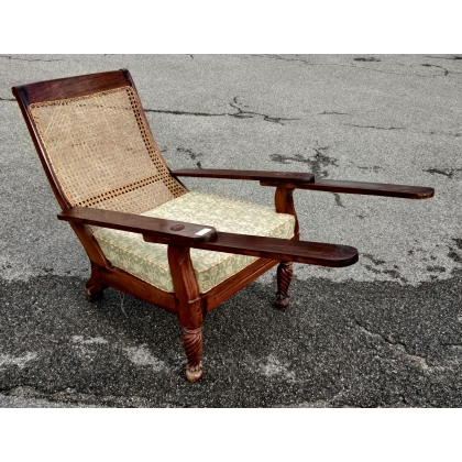 Indonesian rattan armchair, as is, at Moinat SA – Antiques and home décor