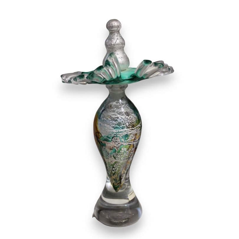 Green and yellow glass bottle marked LUZORO 01