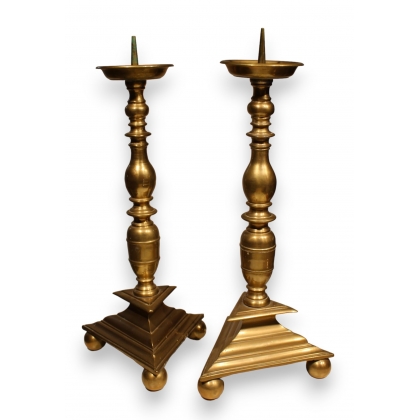 A pair of bronze candlesticks